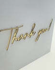 Cutie de dar plexiglas alb personalizată, inscripție aurie 3D „Thank you!”, modernă și elegantă, Diandra Events.